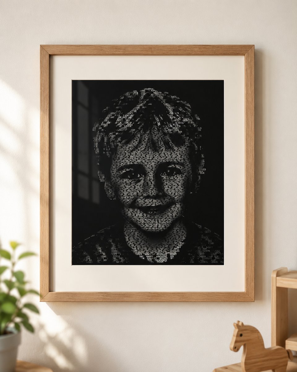 Framed word-art portrait of a child, matted in a light-oak frame on a wall